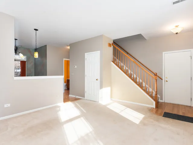 a view of a hallway view with staircase