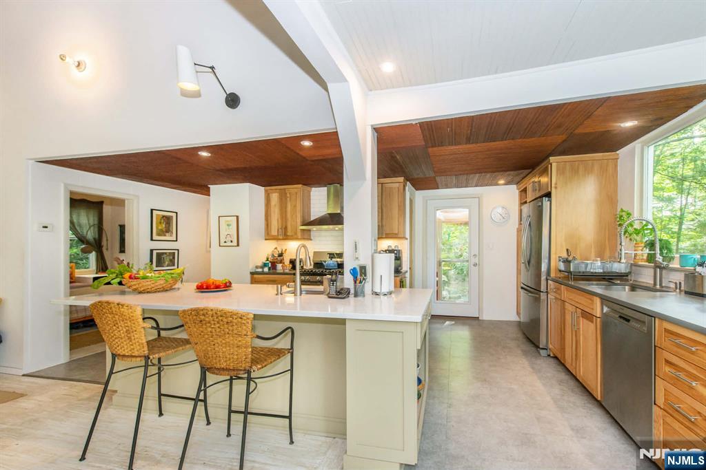 37 N Road Bloomingdale, NJ 07420 - Photo 13 of 18 a dining hall with stainless steel appliances granite countertop a stove and cabinets