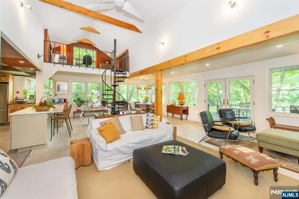 37 N Road Bloomingdale, NJ 07420 - Photo 4 of 18 a living room with furniture kitchen view and large windows