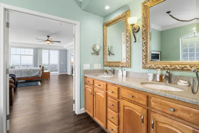 a bathroom with a sink toilet a mirror and shower