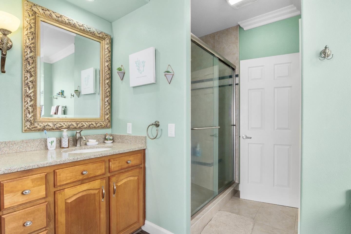 960 Smith Road Watsonville, CA 95076 - Photo 28 of 68 a bathroom with a granite countertop sink mirror and double