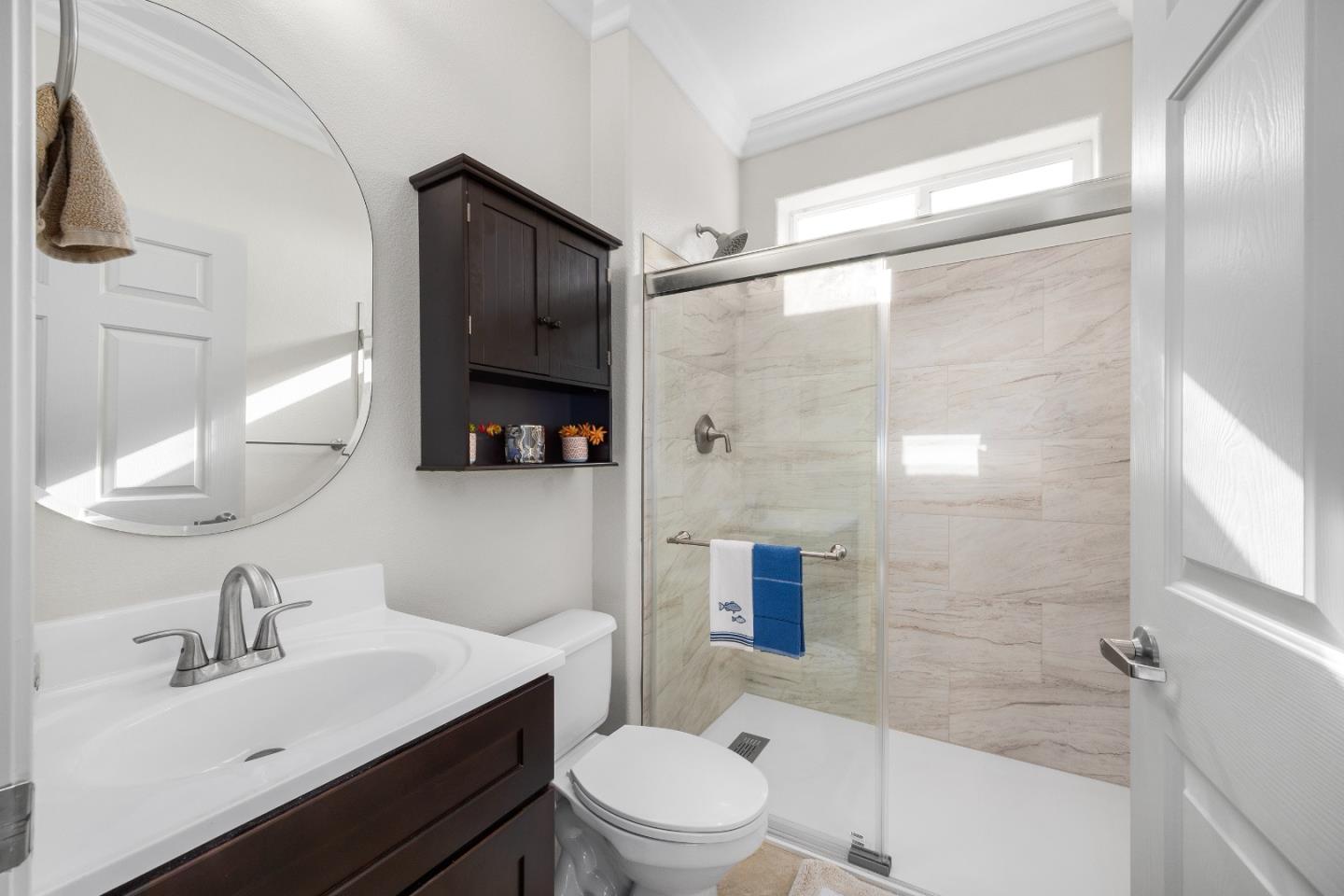 960 Smith Road Watsonville, CA 95076 - Photo 34 of 68 a bathroom with a sink toilet a mirror and shower
