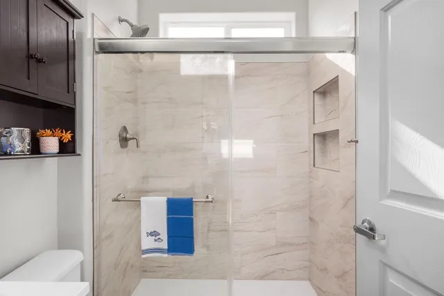 a kitchen with a refrigerator a stove top oven a sink and dishwasher