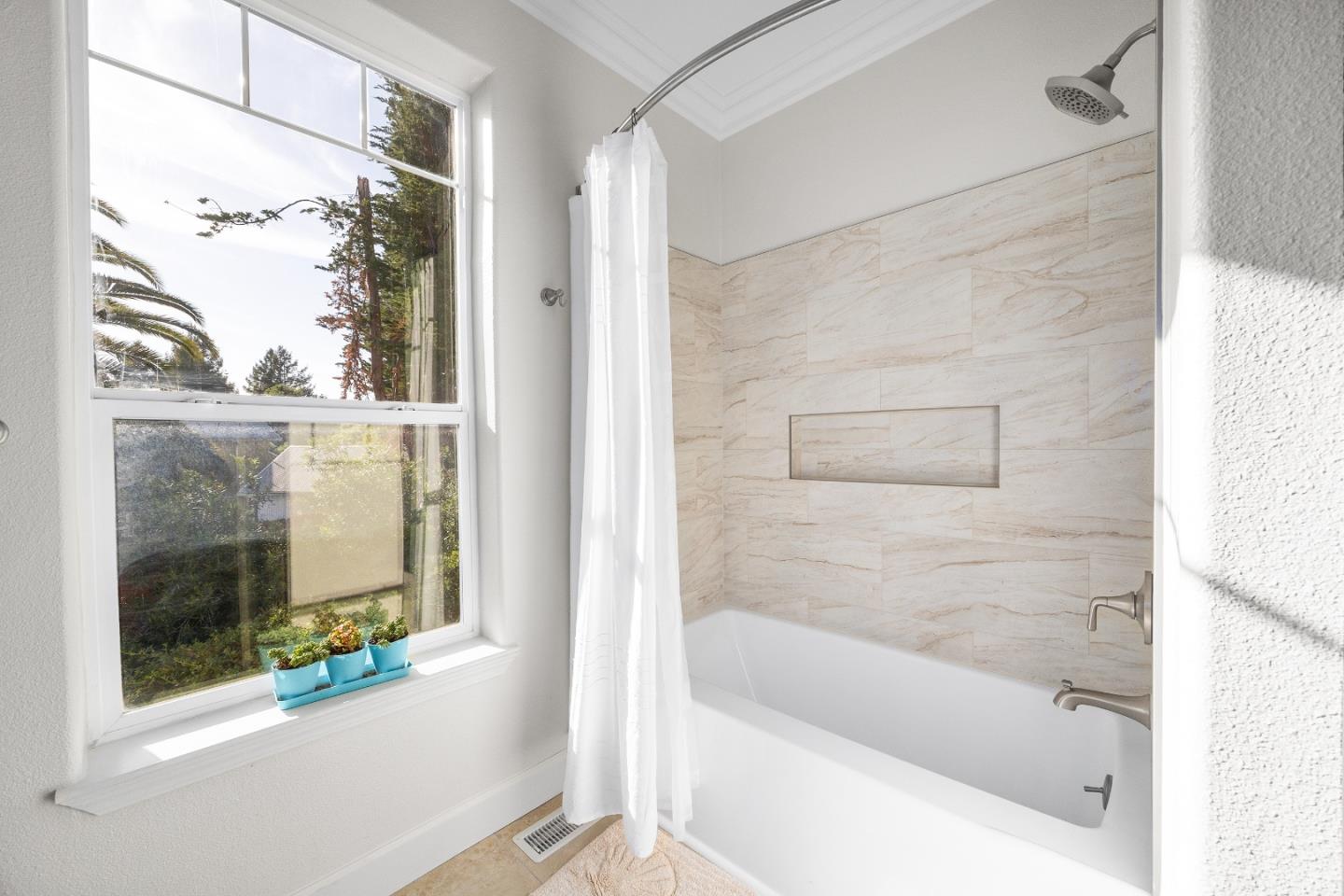 960 Smith Road Watsonville, CA 95076 - Photo 39 of 68 a bathroom with a bathtub and a shower