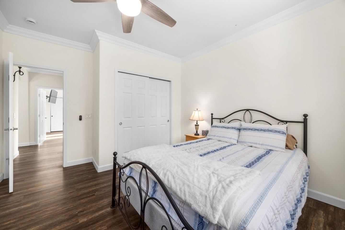 960 Smith Road Watsonville, CA 95076 - Photo 41 of 68 a bedroom with a bed and a chandelier