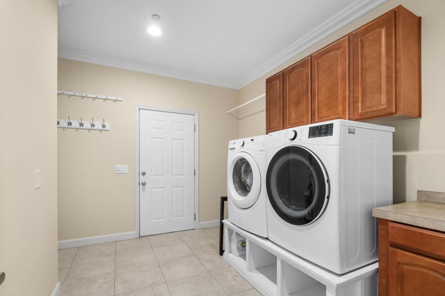 960 Smith Road Watsonville, CA 95076 - Photo 42 of 68 a utility room with dryer washer and a view of kitchen