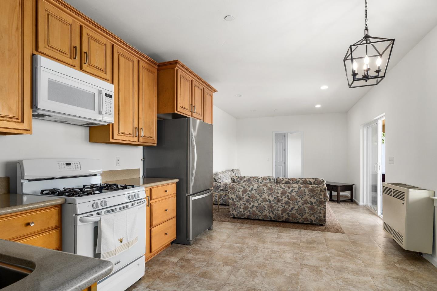 960 Smith Road Watsonville, CA 95076 - Photo 43 of 68 a kitchen with stainless steel appliances granite countertop a stove and cabinets