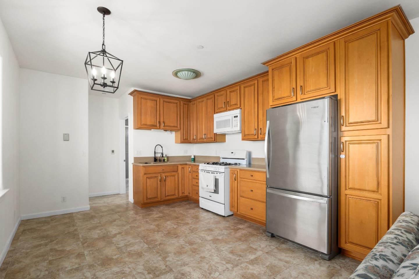 960 Smith Road Watsonville, CA 95076 - Photo 44 of 68 a kitchen with a refrigerator a stove top oven a sink and dishwasher