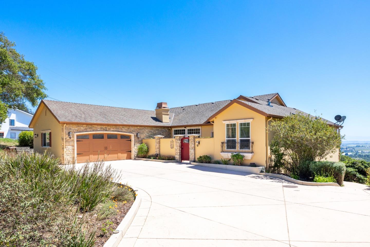 960 Smith Road Watsonville, CA 95076 - Photo 58 of 68 a front view of a house with a yard and garage