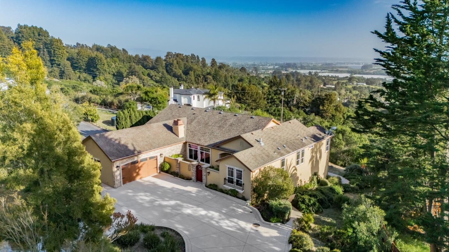 960 Smith Road Watsonville, CA 95076 - Photo 64 of 68 an aerial view of a house with a yard and mountain view in back