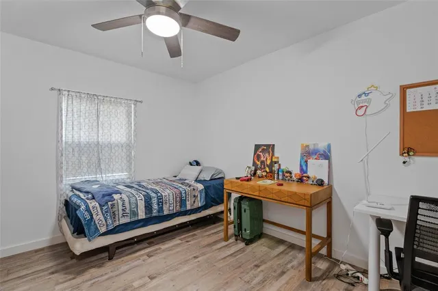 a bedroom with furniture and a bed