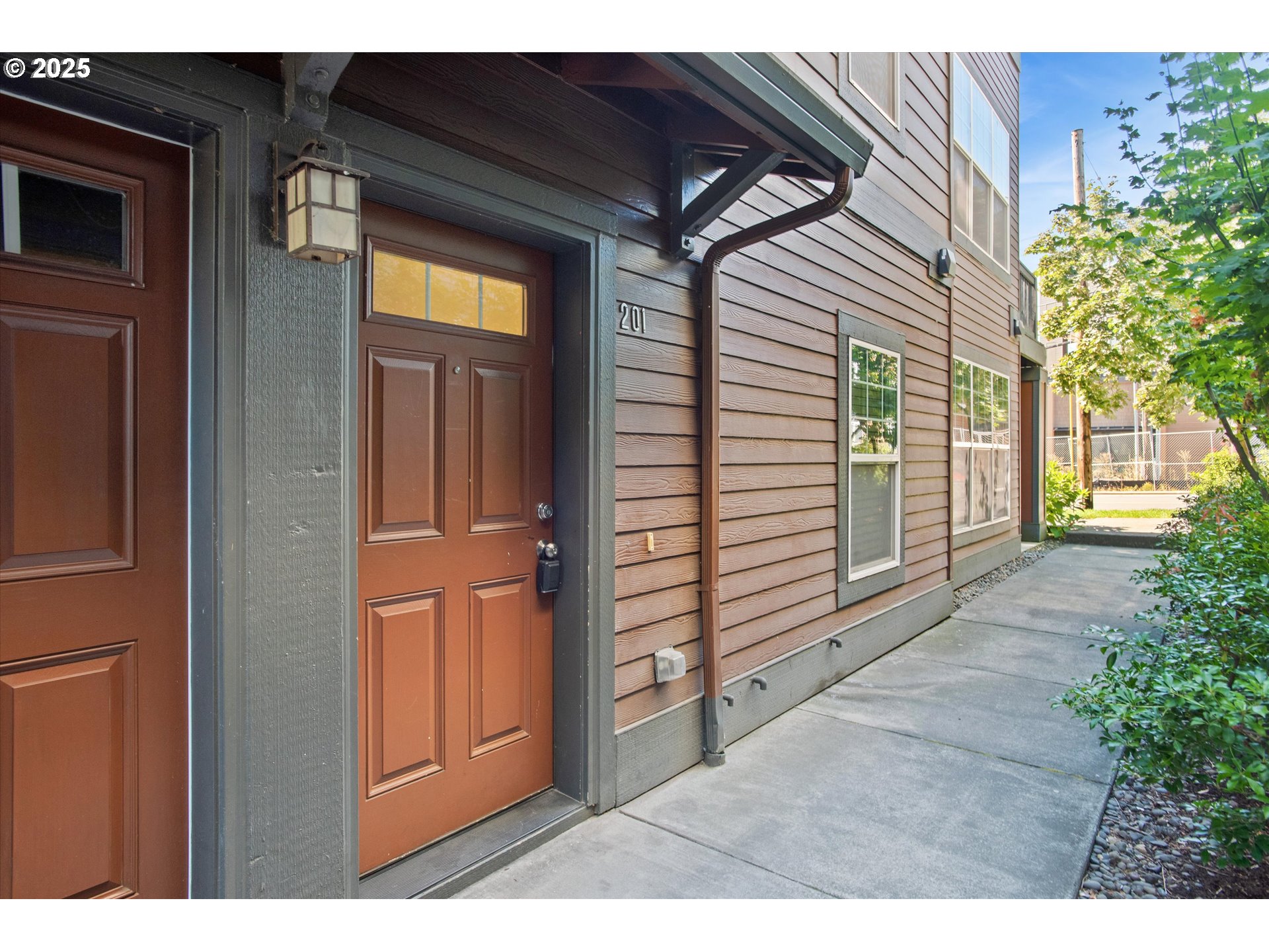 1000 Southwest 170th Avenue, Unit 201 Beaverton, OR 97003 - Photo 2 of 14 a view of a porch with a door and wooden floor