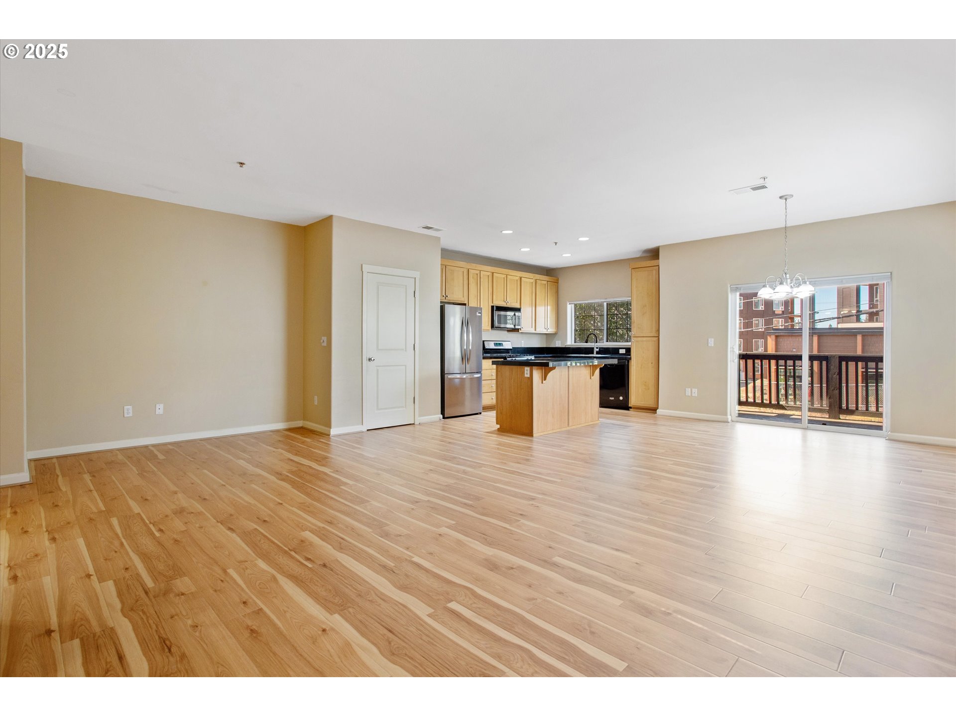 1000 Southwest 170th Avenue, Unit 201 Beaverton, OR 97003 - Photo 5 of 14 a view of a kitchen with a sink and a refrigerator