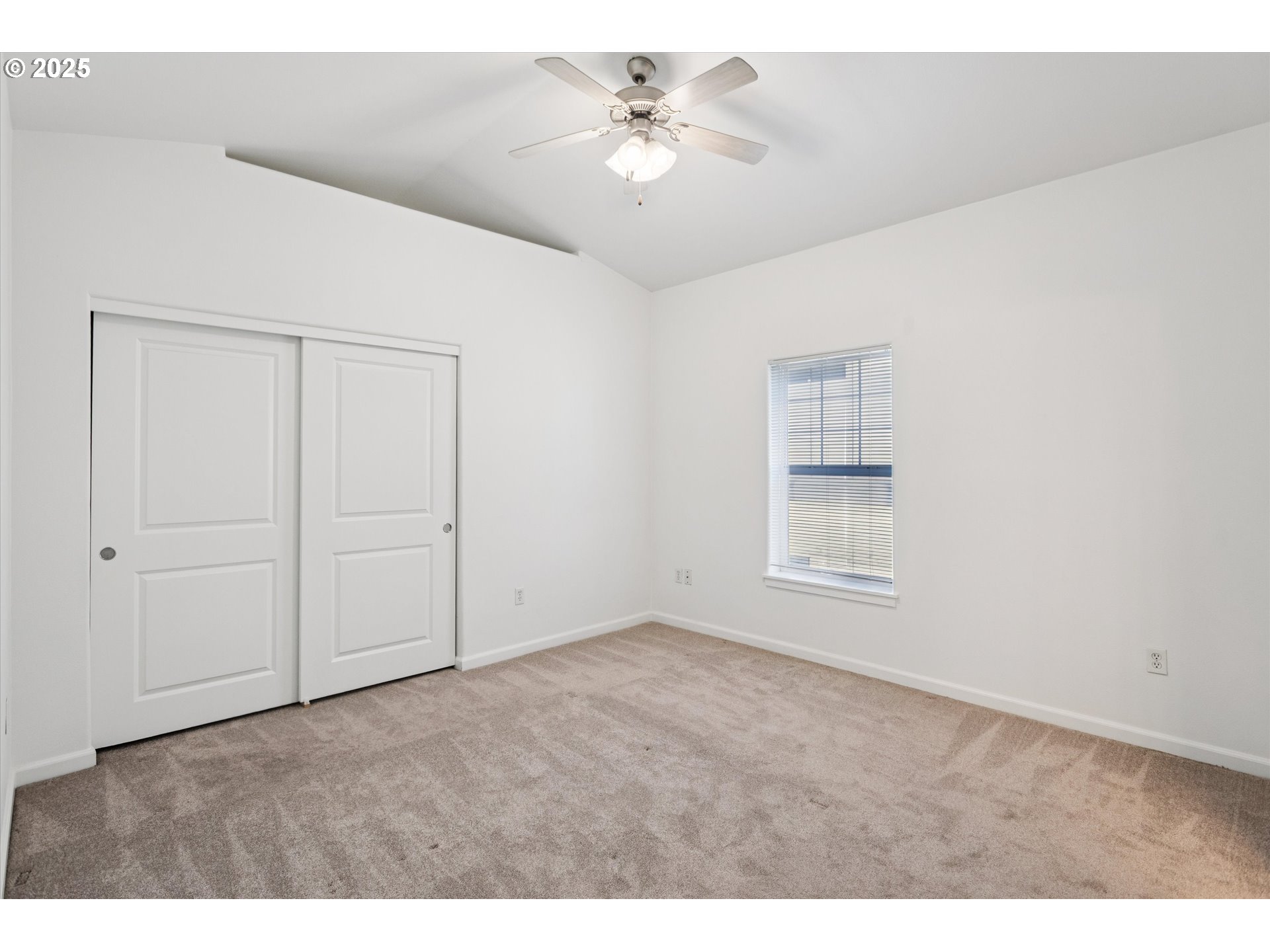 1000 Southwest 170th Avenue, Unit 201 Beaverton, OR 97003 - Photo 8 of 14 a view of an empty room with a ceiling fan