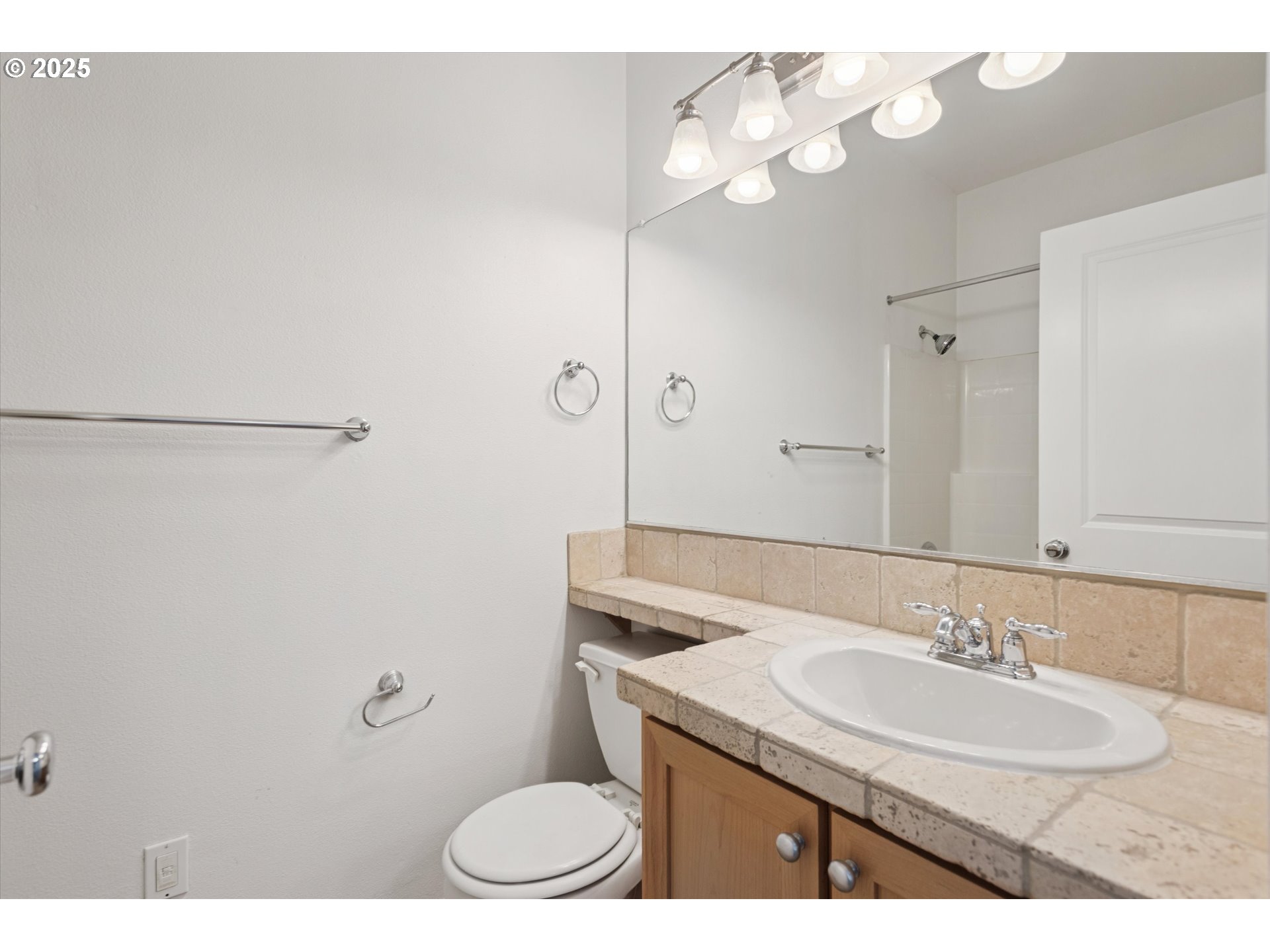 1000 Southwest 170th Avenue, Unit 201 Beaverton, OR 97003 - Photo 9 of 14 a bathroom with a granite countertop sink a toilet and a mirror