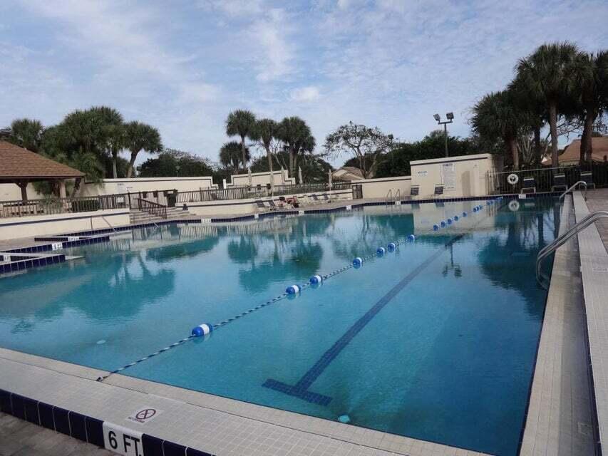 3105 31st Court, Unit 130D Jupiter, FL 33477 - Photo 18 of 24 a view of a lake