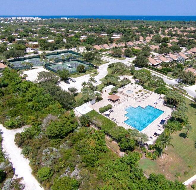 3105 31st Court, Unit 130D Jupiter, FL 33477 - Photo 19 of 24 an aerial view of residential houses with outdoor space and swimming pool