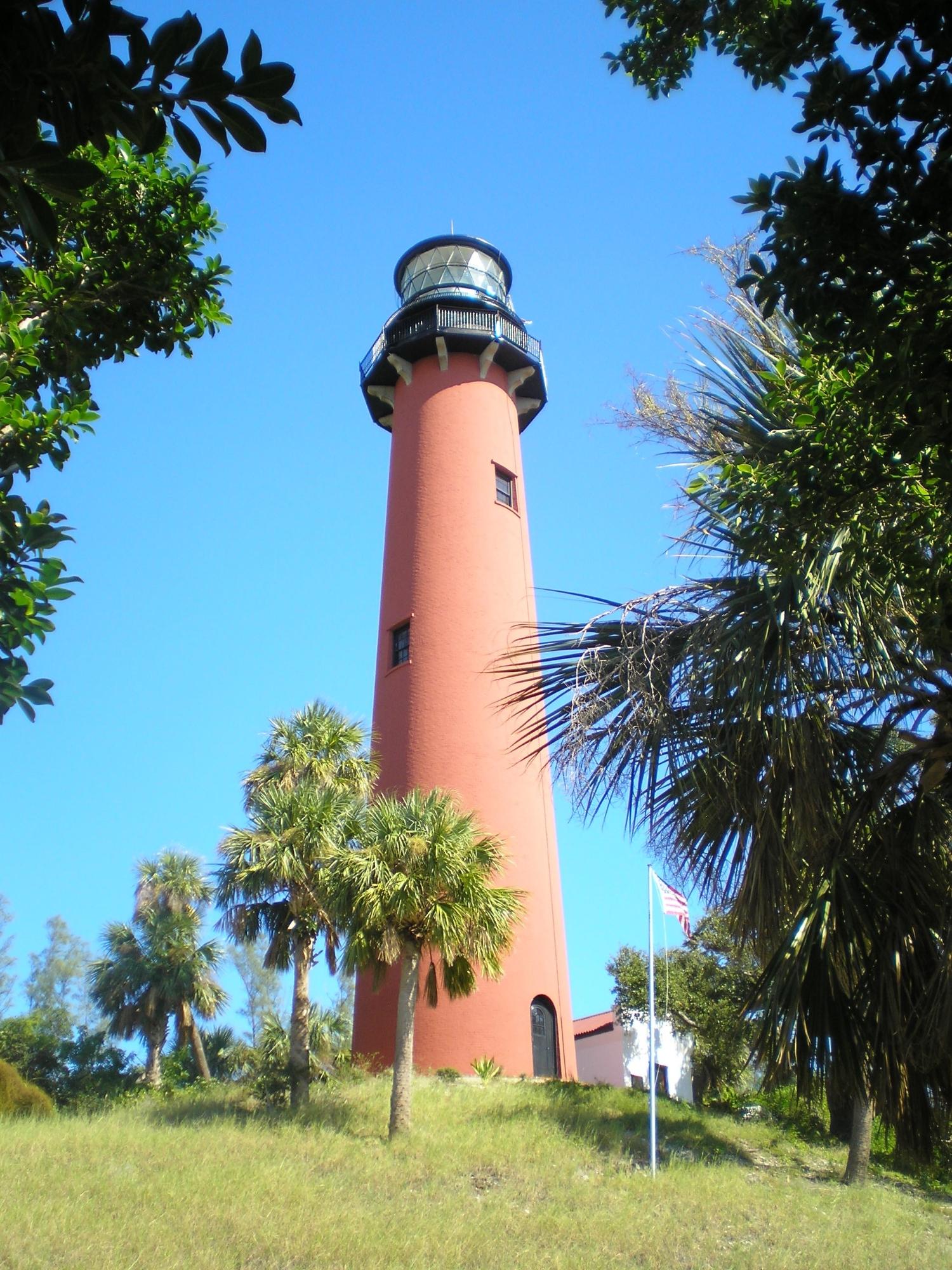 3105 31st Court, Unit 130D Jupiter, FL 33477 - Photo 22 of 24 a front view of a house with a garden