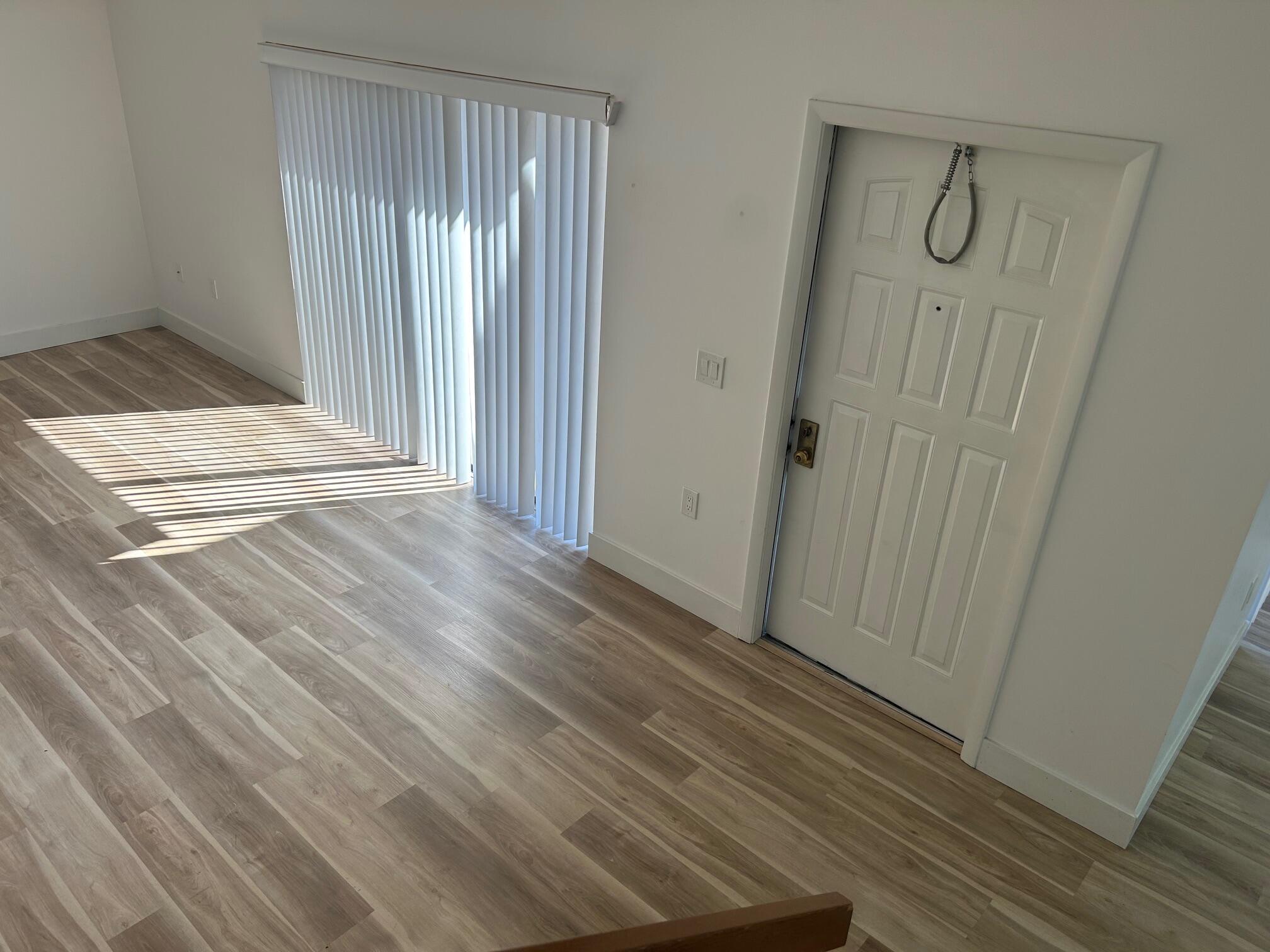 3105 31st Court, Unit 130D Jupiter, FL 33477 - Photo 9 of 24 a view of a bathroom from the empty room