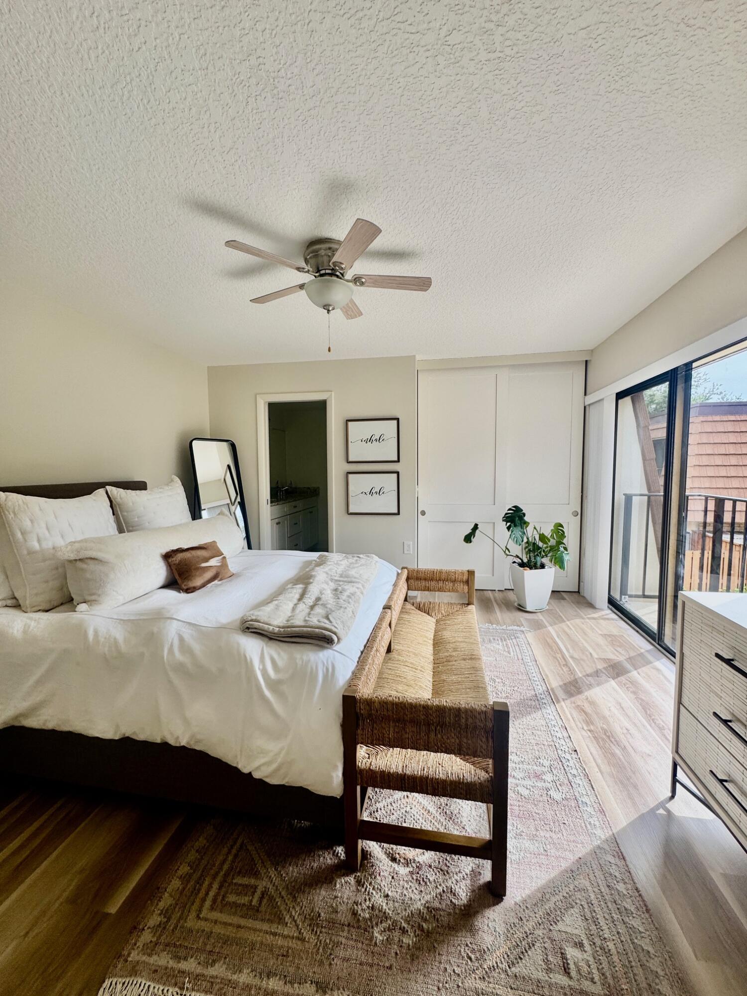 3105 31st Court, Unit 130D Jupiter, FL 33477 - Photo 10 of 24 a view of a bedroom with furniture