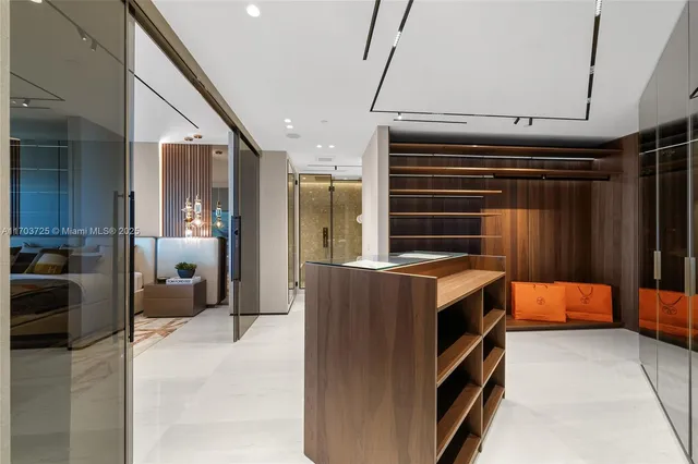 a large kitchen with a sink and refrigerator