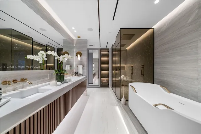 a kitchen with counter top space a sink and a refrigerator