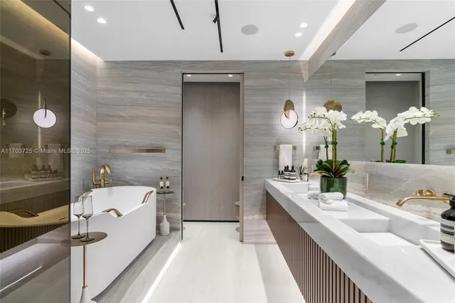 a bedroom with a bed and flat screen tv