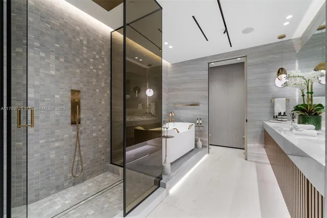 a bedroom with a bed a flat screen tv and dresser