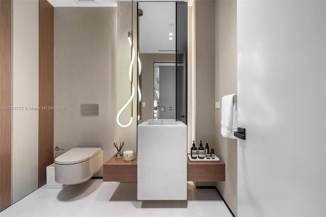 a living room with furniture a flat screen tv and a large window