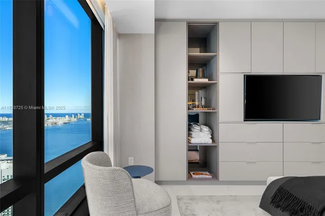 a view of a dining room with furniture water view and kitchen