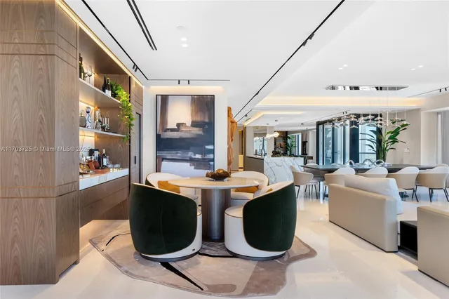 a kitchen with stainless steel appliances kitchen island granite countertop a refrigerator and a stove top oven