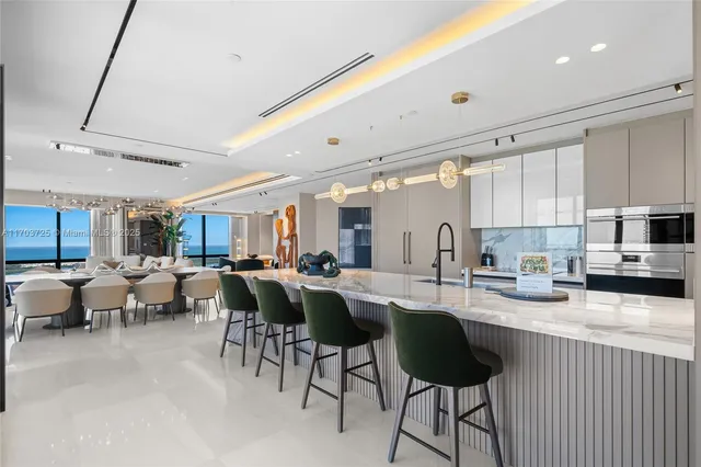 a living room with furniture a flat screen tv and a large window