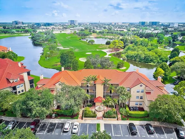 an aerial view of multiple houses with yard