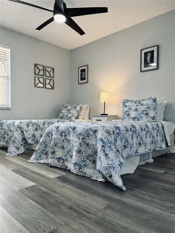 a bedroom with a bed and a couch