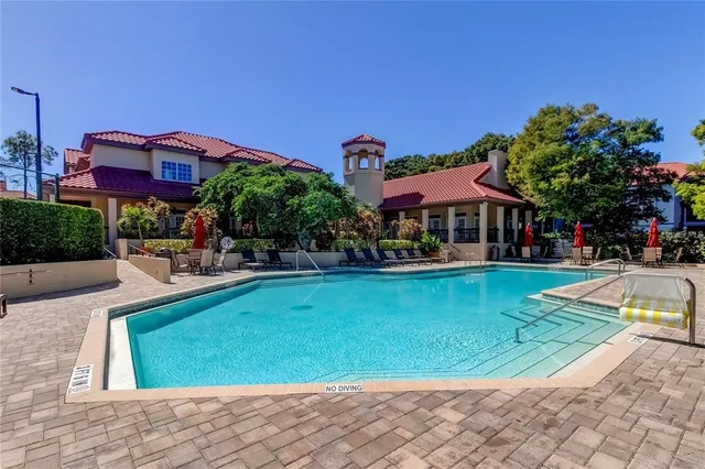 a living room with stainless steel appliances kitchen island a cabinets and wooden floor