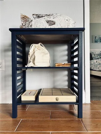 a room with a wooden floor and a stool