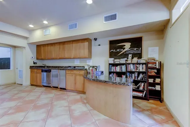 a living room with furniture a rug and a flat screen tv