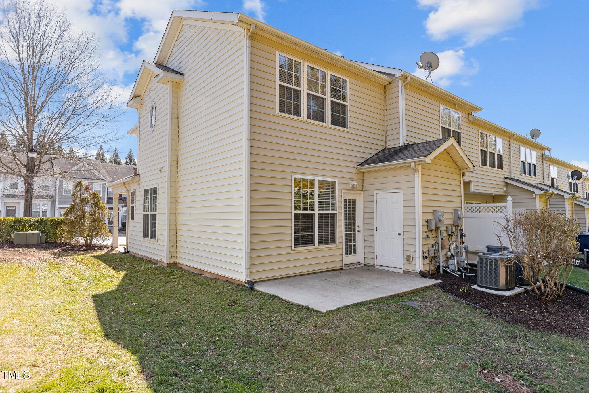 7850 Silverthread Lane Raleigh, NC 27617 - Photo 28 of 28 a view of a house with a yard