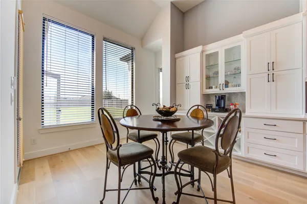 a view of a dining room with furniture and window
