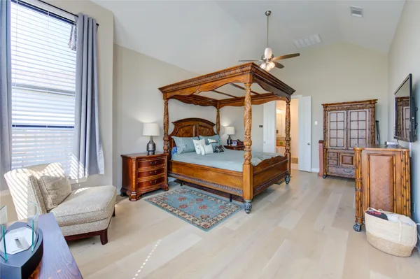 a bedroom with furniture and a chandelier