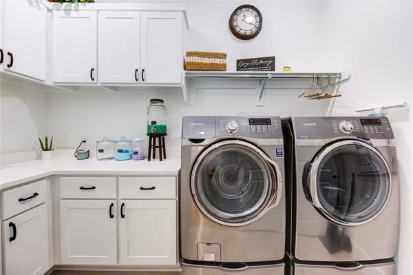 a room with pool table and windows