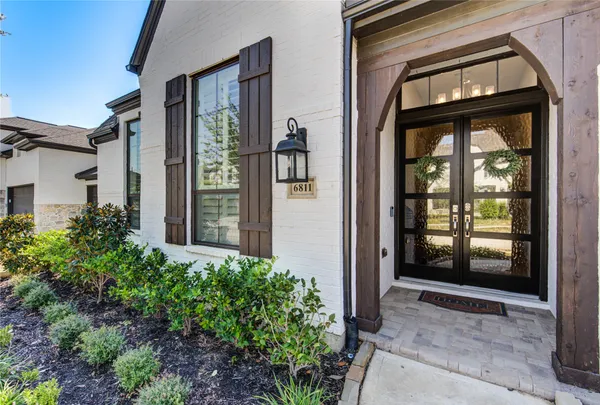 a view of front door and small yard
