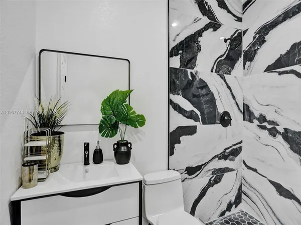 a bedroom with a bed and a couch