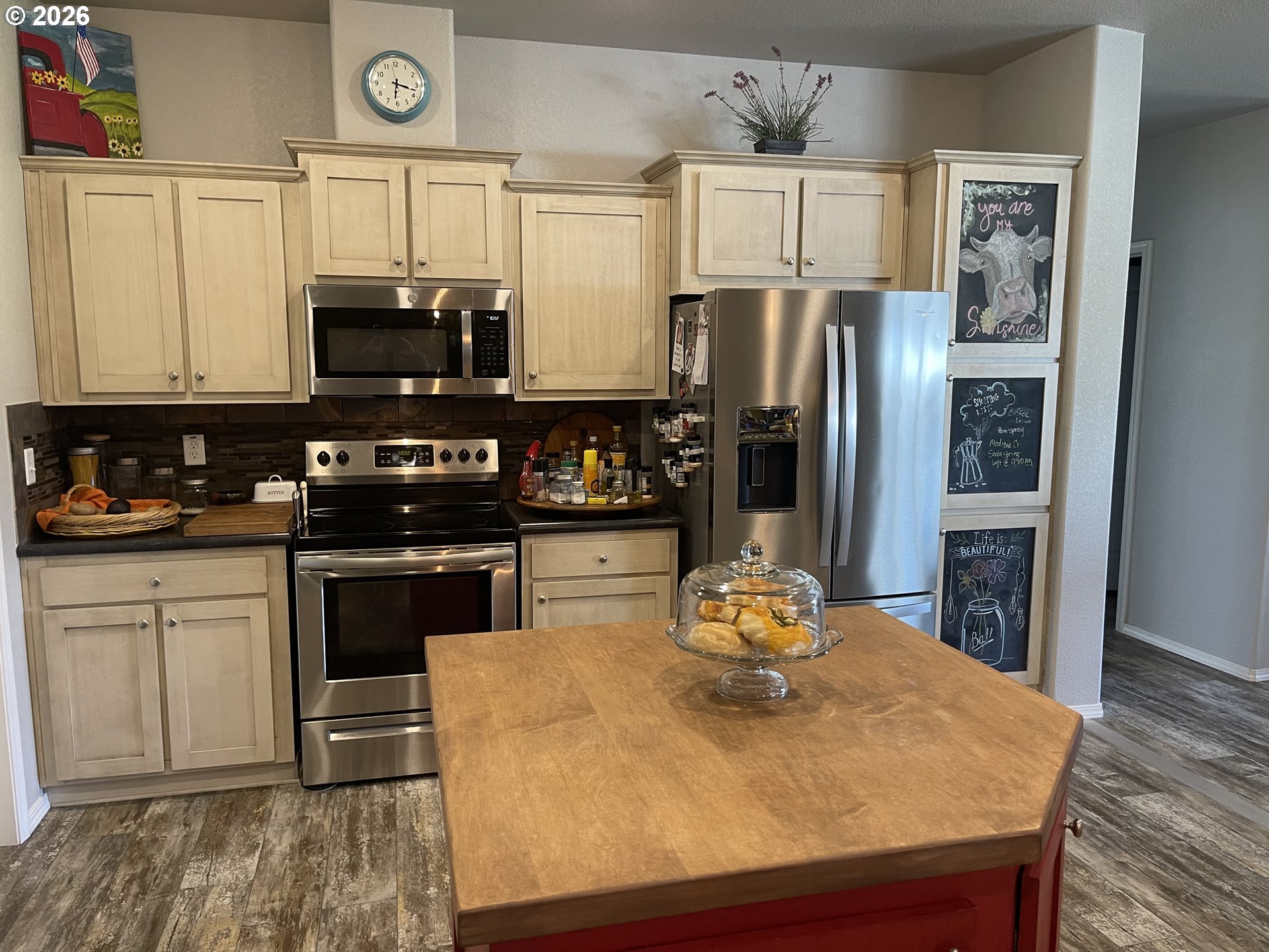6404 Lookingglass Road Roseburg, OR 97471 - Photo 13 of 48 a kitchen with stainless steel appliances granite countertop a refrigerator a stove and a sink