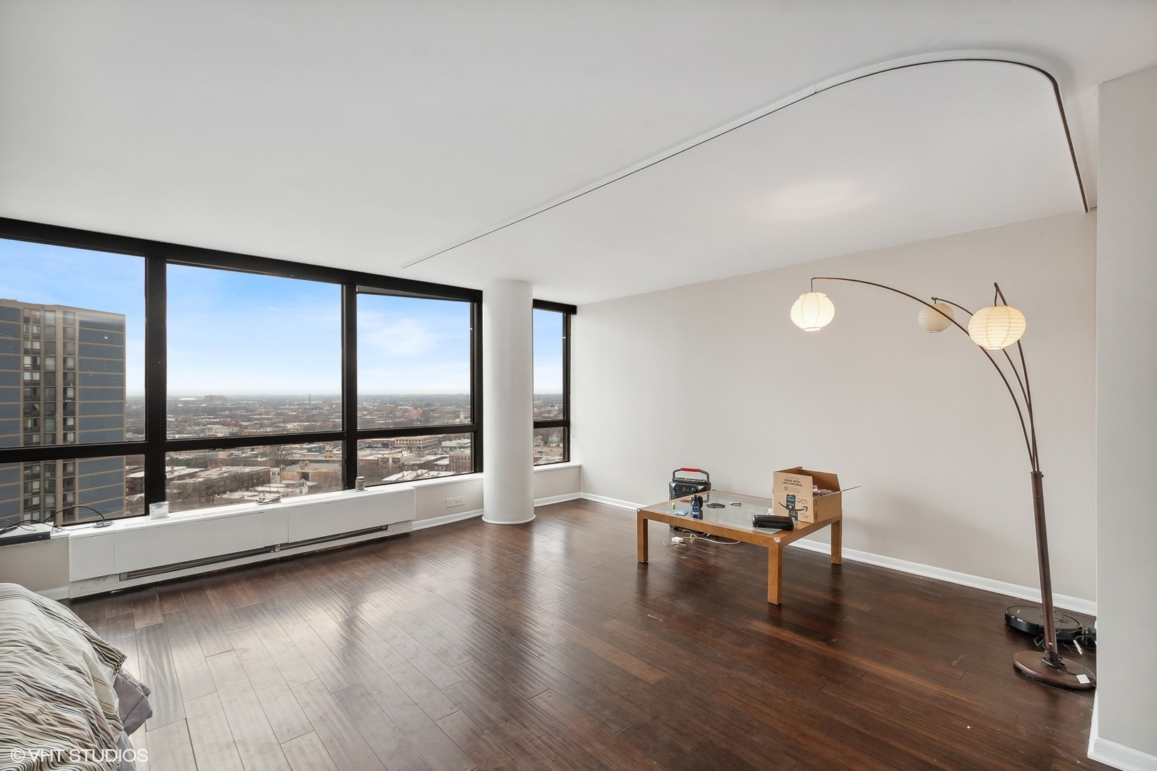 5415 North Sheridan Road, Unit 2103 Chicago, IL 60640 - Photo 5 of 12 a view of an empty room with window and hardwood floor
