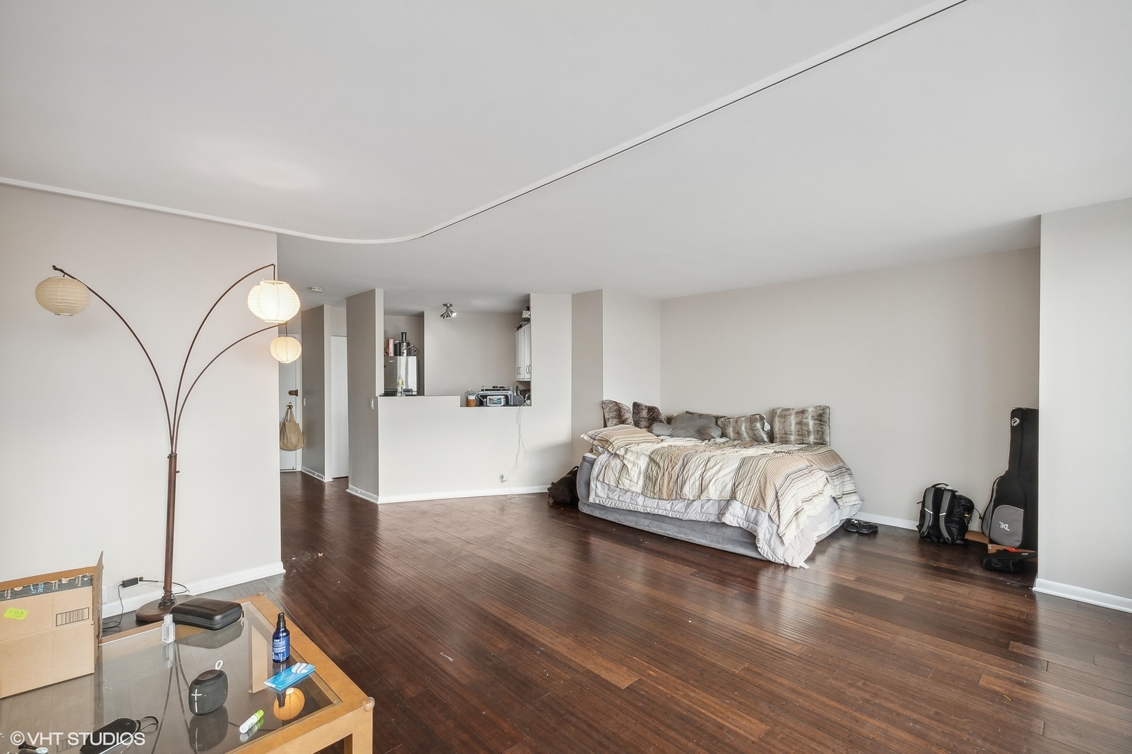 5415 North Sheridan Road, Unit 2103 Chicago, IL 60640 - Photo 7 of 12 a living room with furniture window and wooden floor