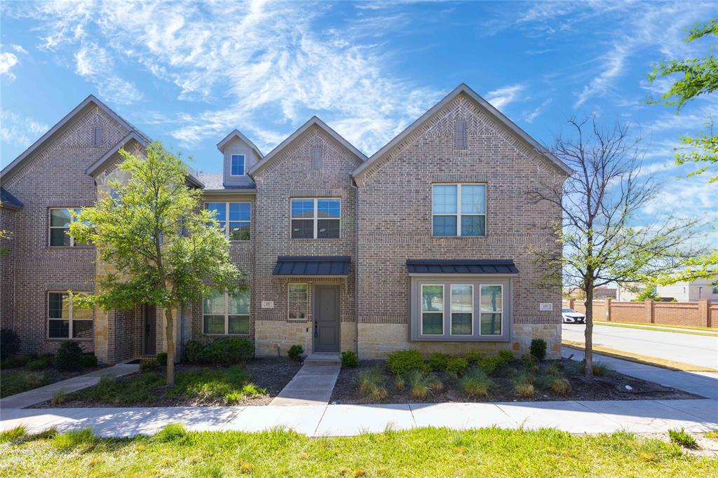 631 Cobblestone Lane Irving, TX 75039 - Photo 2 of 32 a front view of a house with a yard and garage