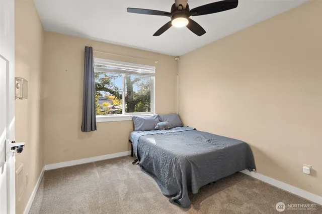 a bed sitting in a room next to a window