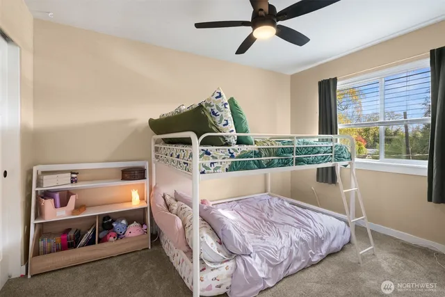 a bedroom with bed and window