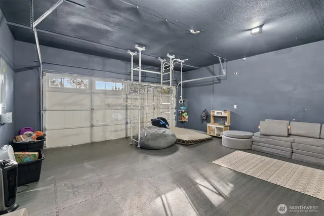 a bedroom with furniture and a flat screen tv